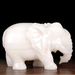 A pair of jade elephants decorate natural Afghan white jade